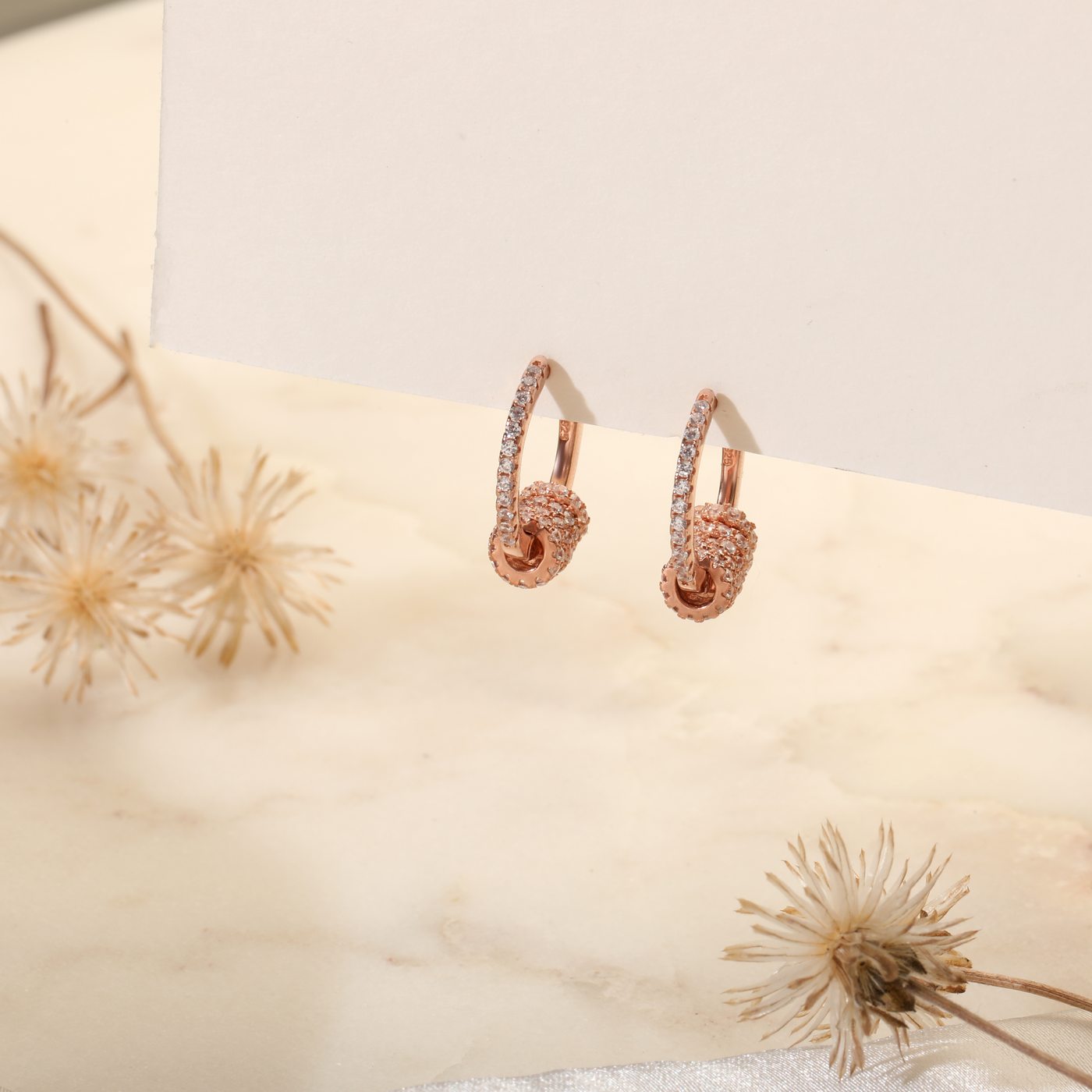 Pave huggie earrings with ball drop, rose gold