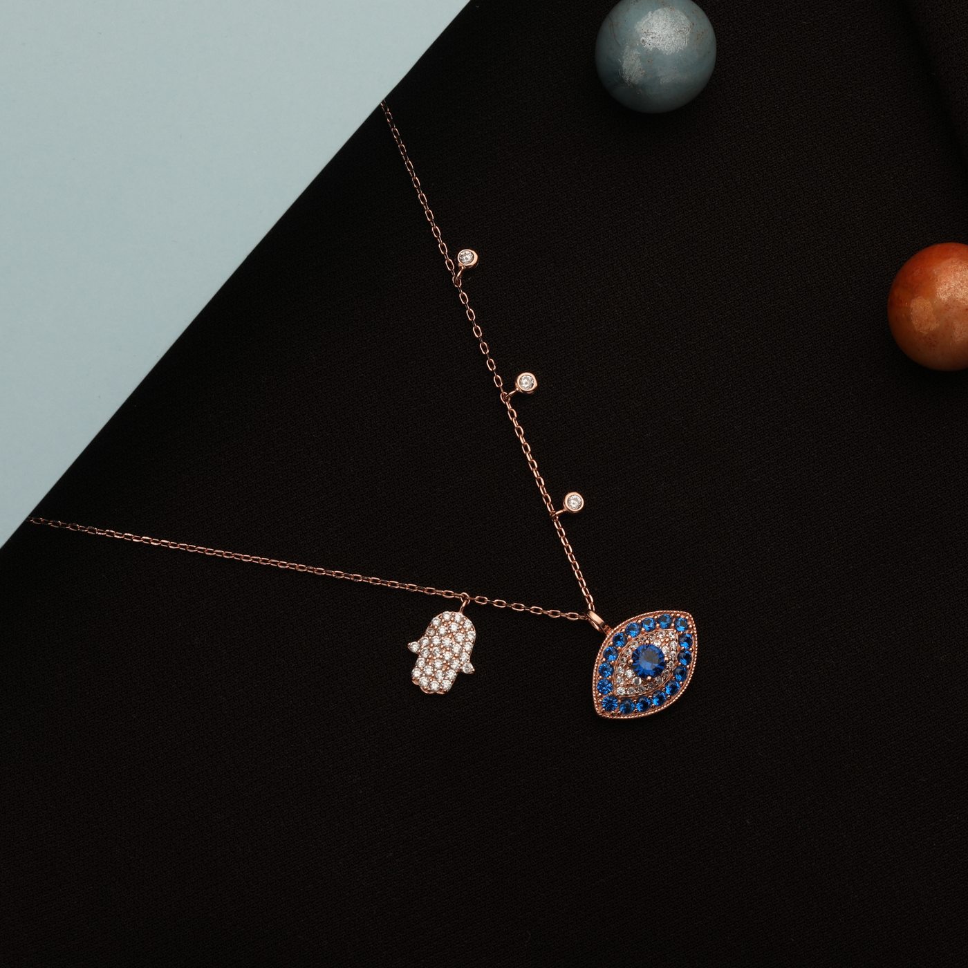 Evil eye and hamsa charm necklace, rose gold