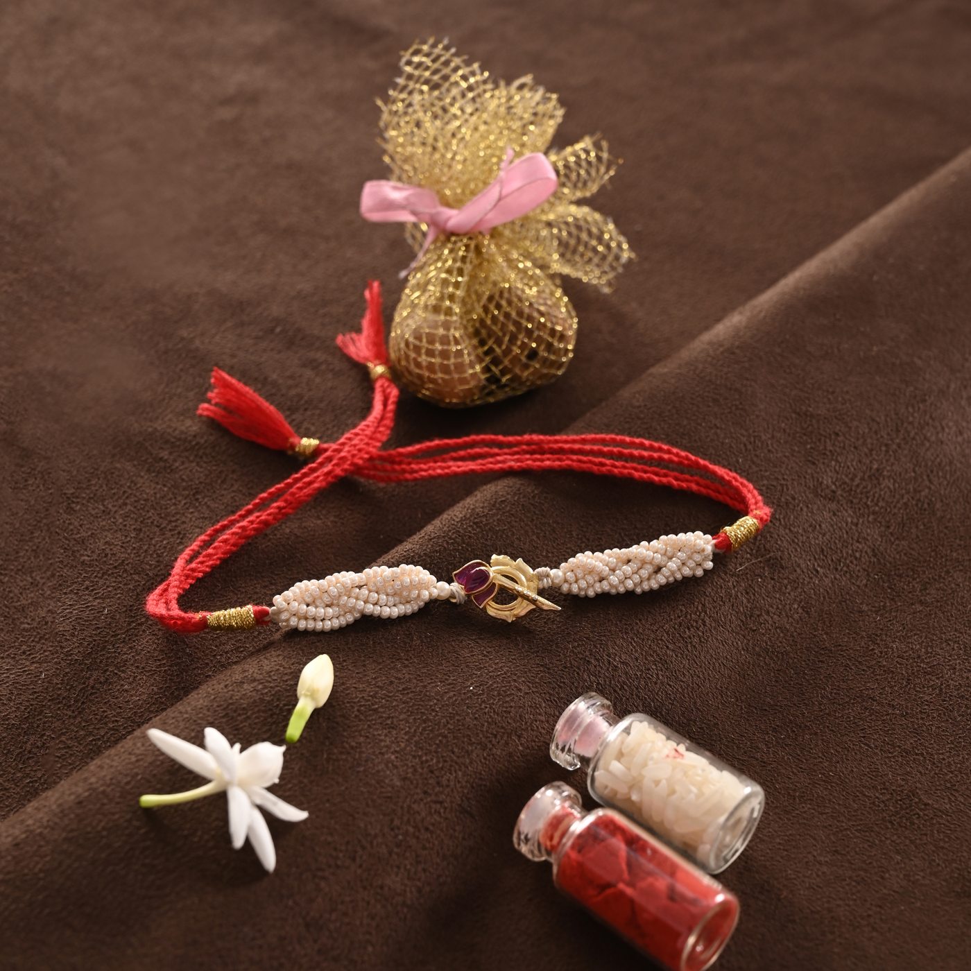Kamal Rakhi, red thread with pearls and lotus charm