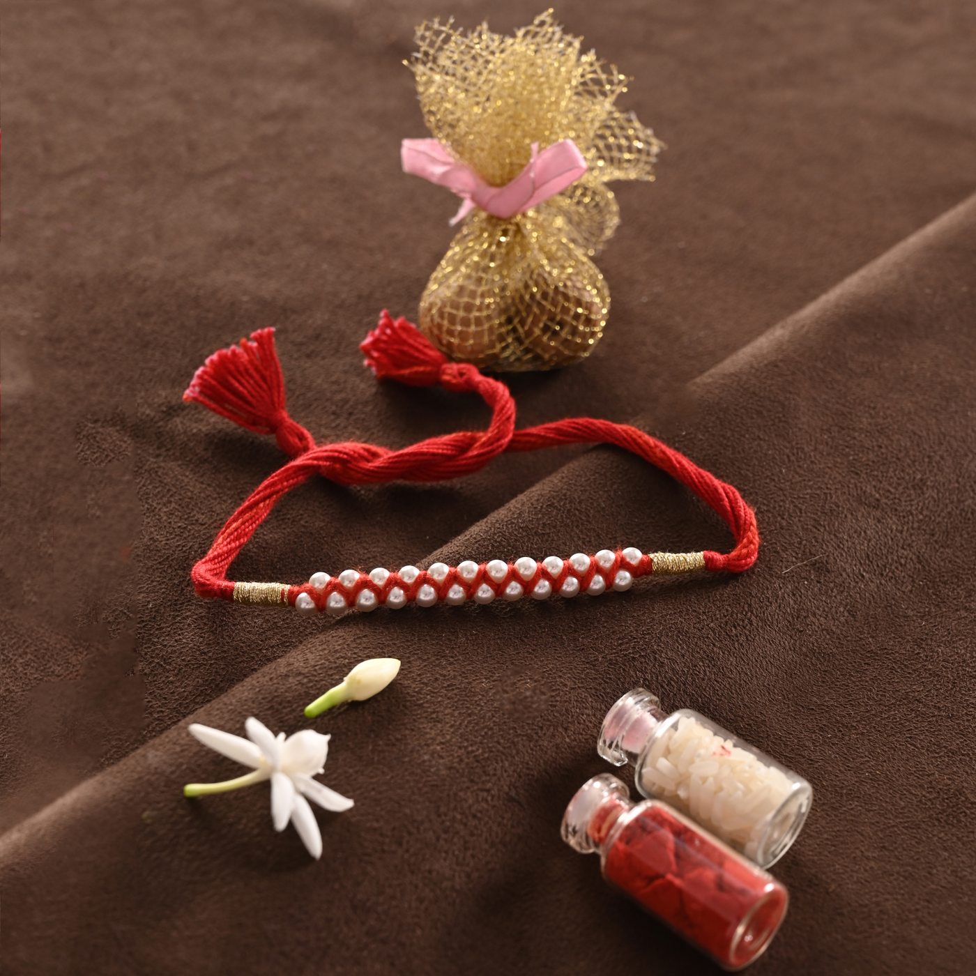 Moti Rakhi, red thread woven with pearls