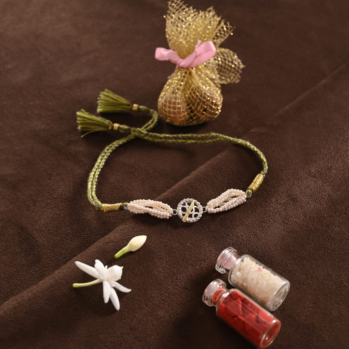 Sudarshan Rakhi, green thread with pearl and chakra charm
